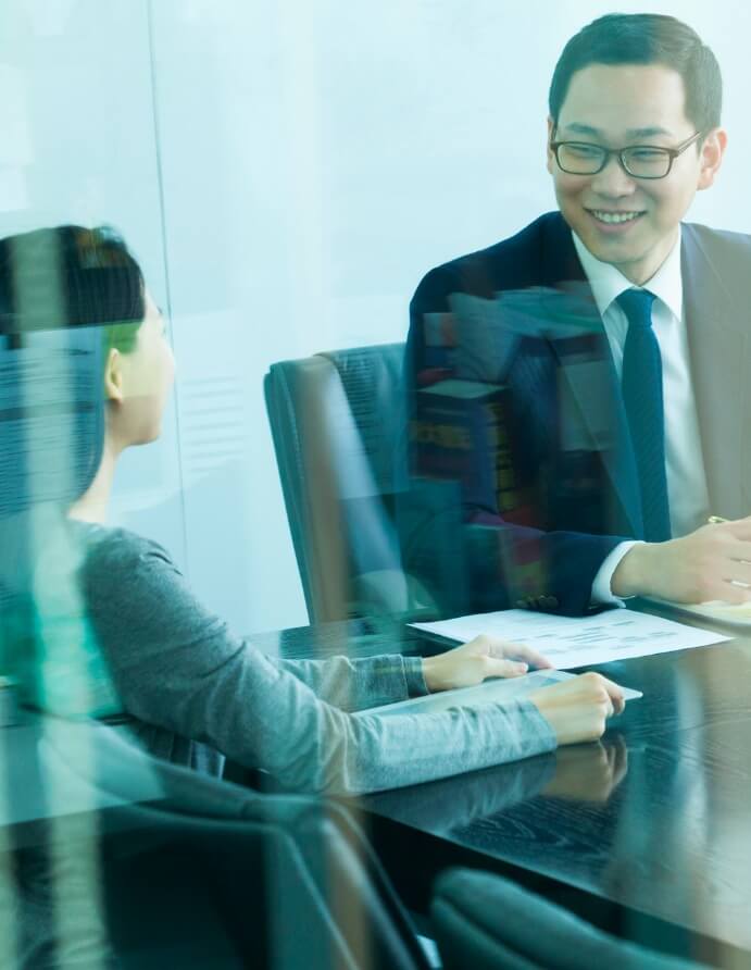 colleagues-meeting-in-conference-room-with-glass-doors-picture-id187345650